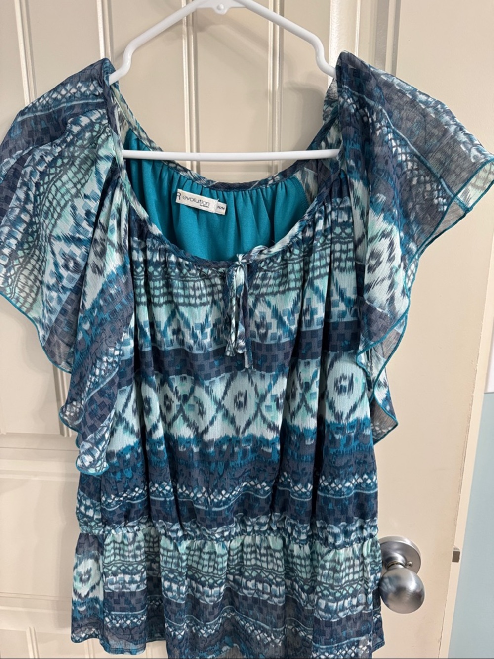 Ricki’s Revolution Blue Teal Patterned Flutter Sleeve Blouse